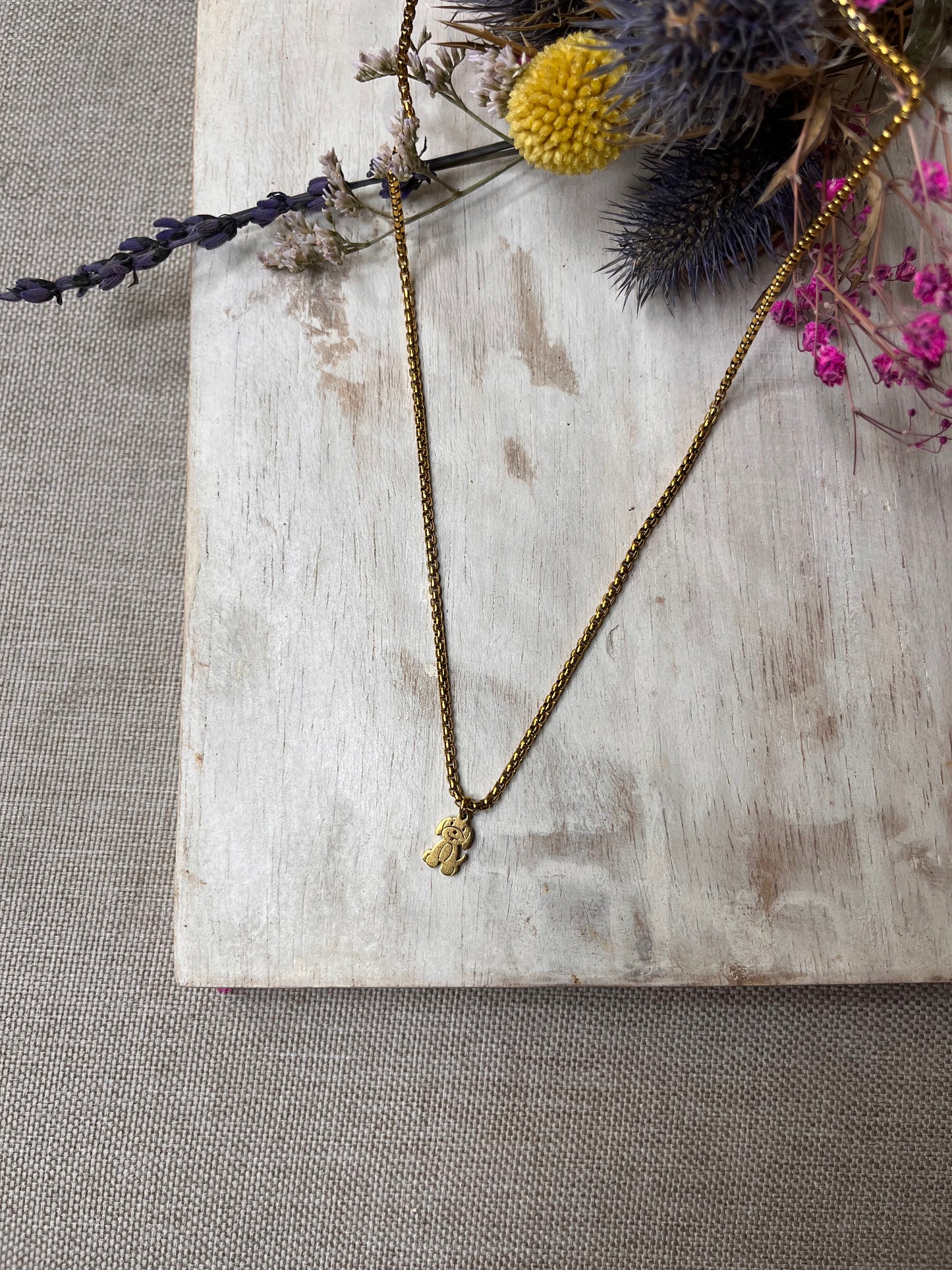 Dog pendant with gold chain